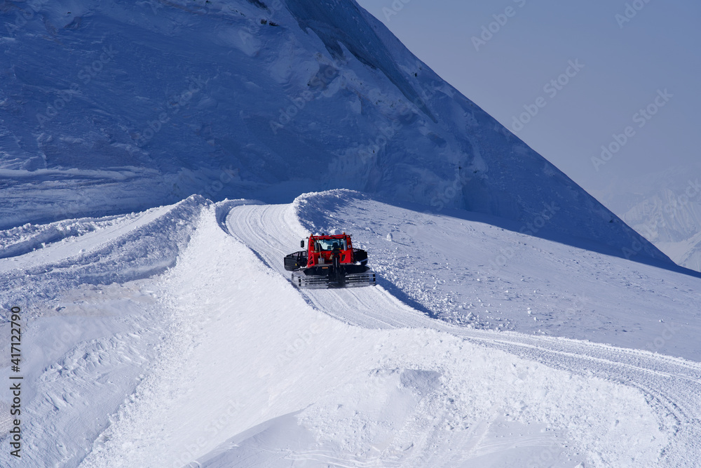 Snowcat preparing to plow the slope. Photo taken February 26th, 2021, Jungfraujoch, Switzerland.
