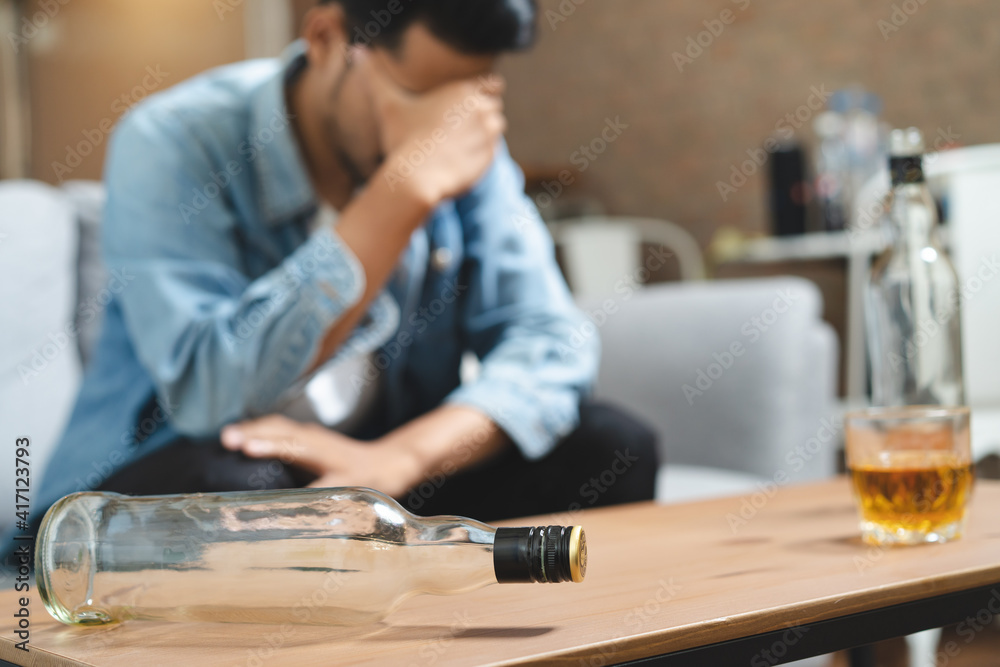 Alcoholism concept. Young man drinking alcohol too much. Alcoholism concept. Young man drinking alcohol too much.