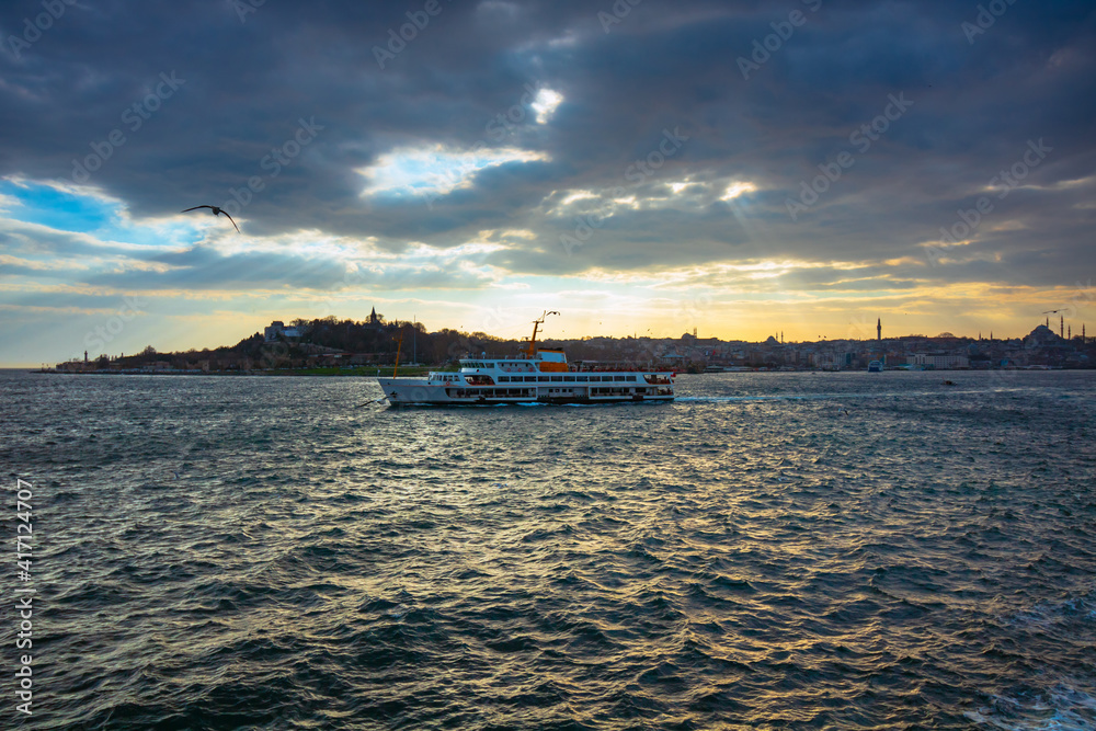 cityscape of Istanbul and a ferry at sunset. Istanbul background photo. Istanbul city line ferries background. Bosphorus and constantinople. cityscape of Istanbul and a ferry at sunset. Istanbul background photo. Istanbul city line ferries background. Bosphorus and constantinople.