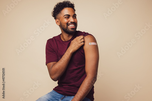 Man smiling after receiving vaccination photo