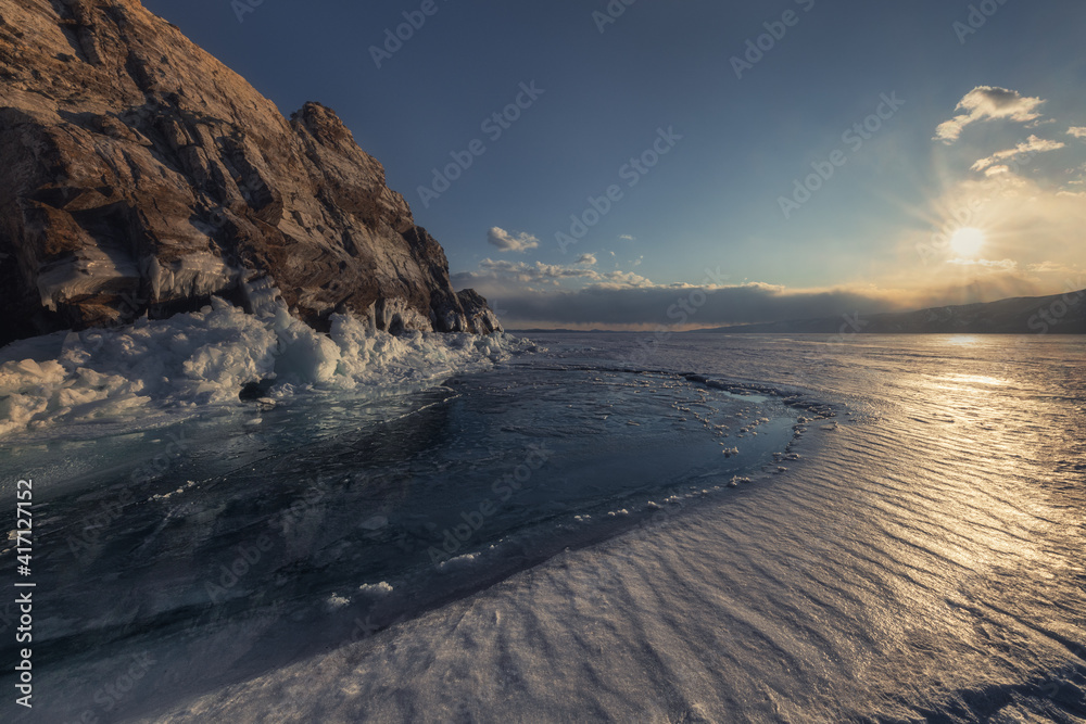 Towards the sunset. Izhilkhey island (Elenka), the Small Sea, Lake Baikal, Siberia, Russia Towards the sunset. Izhilkhey island (Elenka), the Small Sea, Lake Baikal, Siberia, Russia