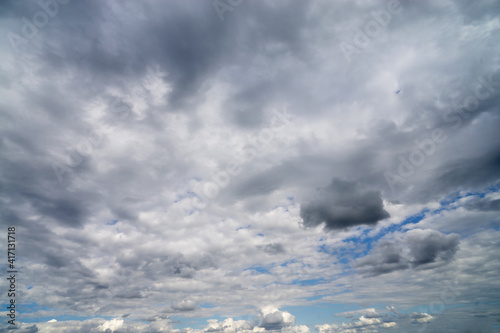 Fototapeta Naklejka Na Ścianę i Meble -  Dark cumulus clouds against a blue sky.