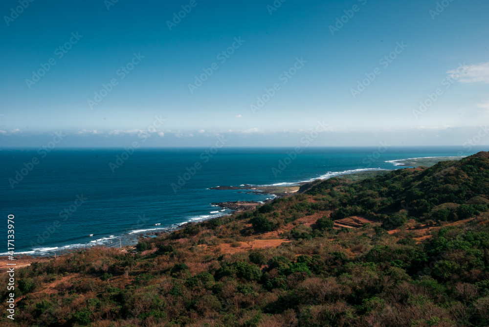 Panoramic view of the blue sea from a mountain top