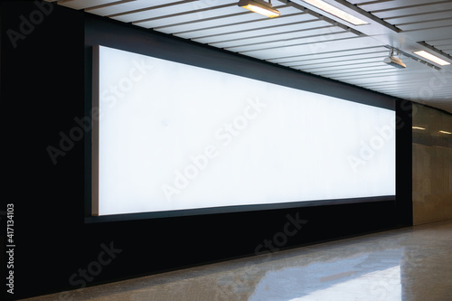 Blank billboard mock up signboard frame advertising located in subway underground hall, blurred background layout insert text for customer