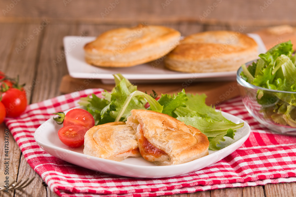 Puff pastry filled with tomato and mozzarella cheese. Puff pastry filled with tomato and mozzarella cheese.
