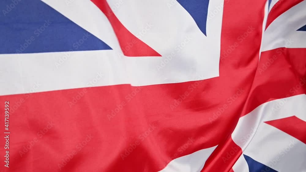 Background of UK flag waving in the wind Background of UK flag waving in the wind
