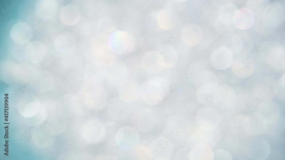 Abstract background of silver bokeh spinning Abstract background of silver bokeh spinning