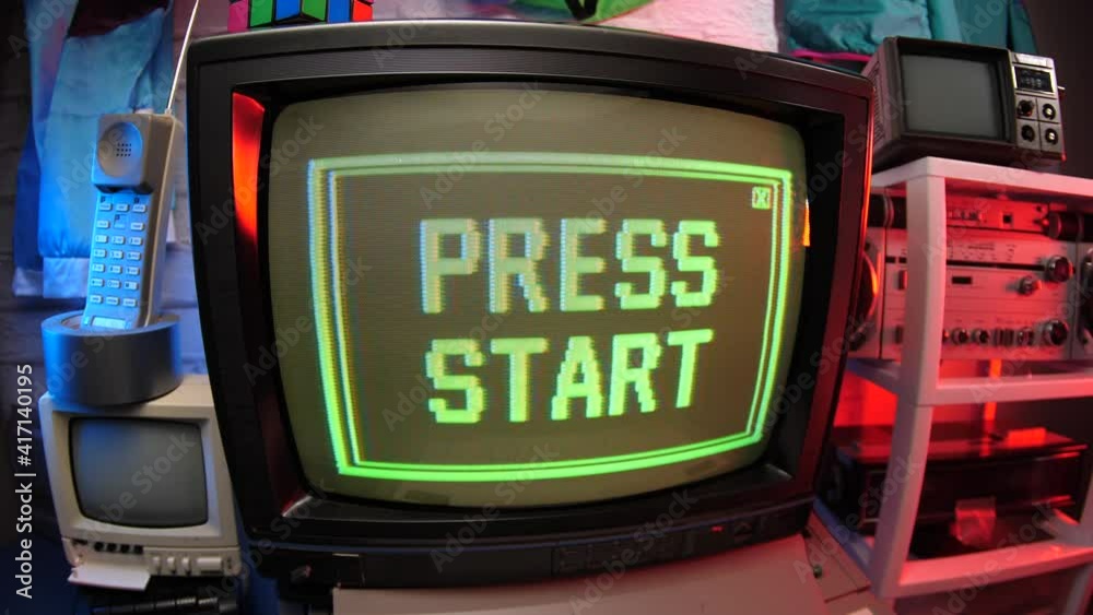 Retro video game concept showing PRESS START message on a computer screen. 80s 90s scene.