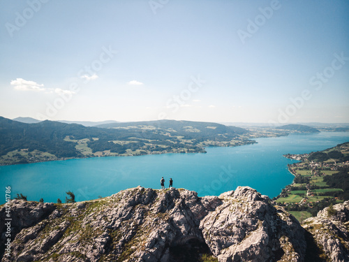 Two people standing on top of the Schoberstein summit at the Attersee in Upper Austria, Austria photo