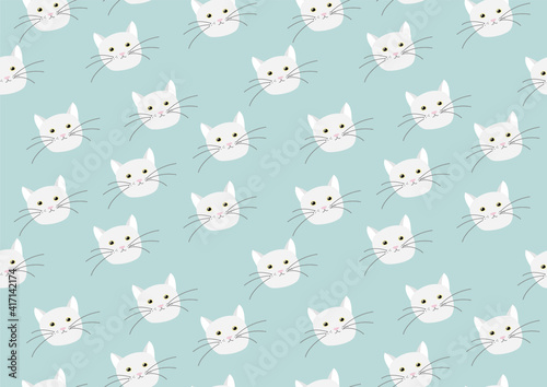 Seamless pattern with cute, funny cat heads on a blue background