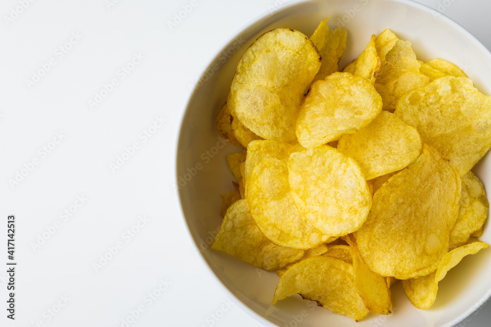 Crispy potato chips. Snacks Fast food or junk food snacks unhealthy concept. Crispy potato chips. Snacks Fast food or junk food snacks unhealthy concept.