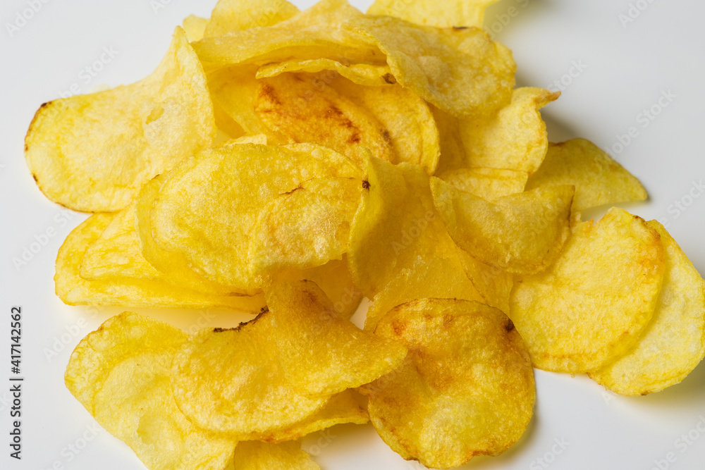 Crispy potato chips. Snacks Fast food or junk food snacks unhealthy concept. Crispy potato chips. Snacks Fast food or junk food snacks unhealthy concept.
