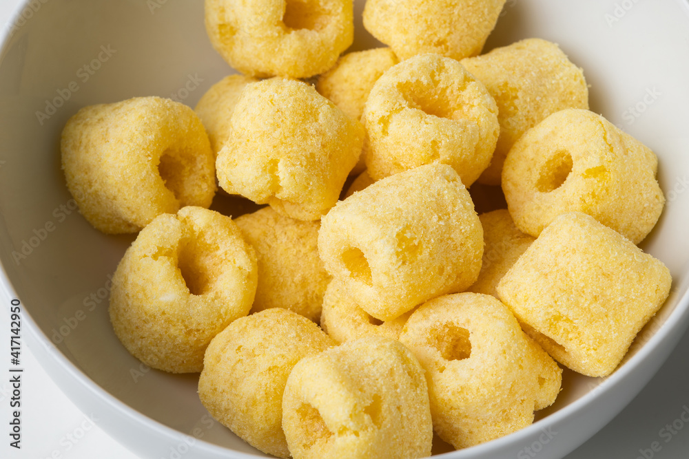 Crispy Corn rings salty snacks. Fast food or junk food snacks unhealthy concept. Crispy Corn rings salty snacks. Fast food or junk food snacks unhealthy concept.