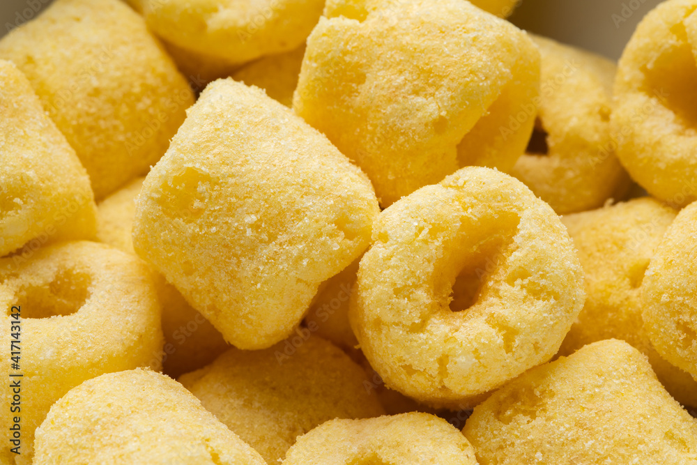 Crispy Corn rings salty snacks. Fast food or junk food snacks unhealthy concept.