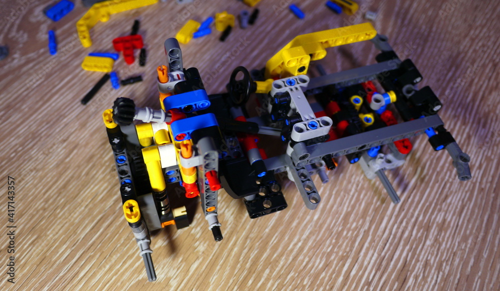 Obraz premium Assembling a toy constructor by a child.