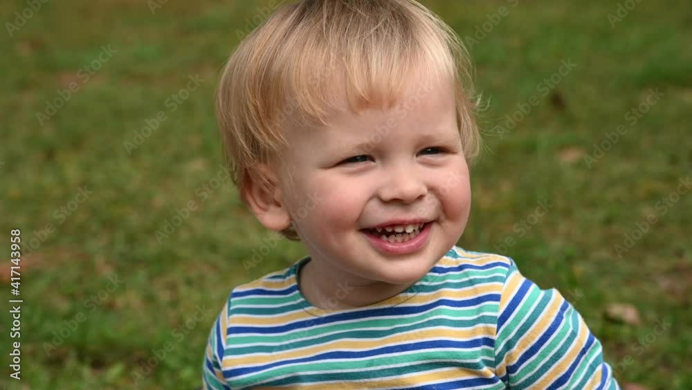 Little boy playing having fun and shaking his had Little boy playing having fun and shaking his had