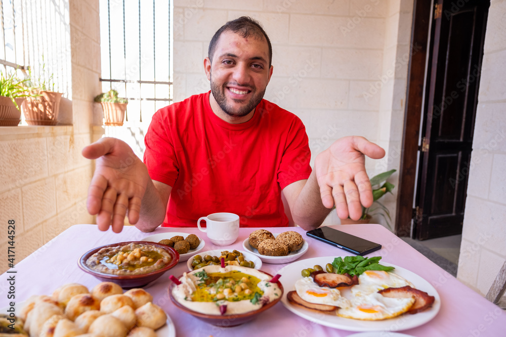 Muslim man is welcoming others to join him Muslim man is welcoming others to join him
