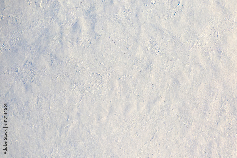 Obraz premium White fluffy snow, texture or background, top view.