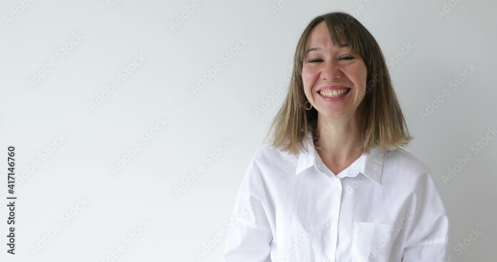 Portrait of cheerful woman looking at camera with happy emotion enjoying successful lifestyle on white background Portrait of cheerful woman looking at camera with happy emotion enjoying successful lifestyle on white background