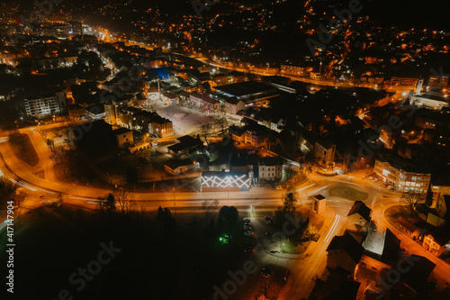 Aerial view of downtown Tuzla at night  Bosnia. City photographed by drone  traffic and objects   landscape