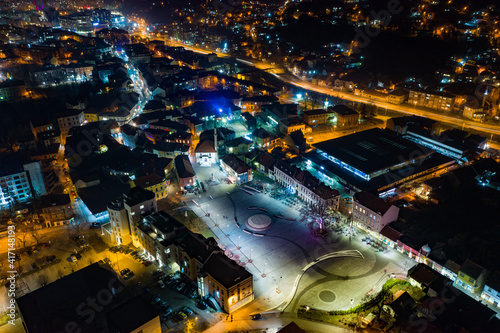 Aerial view of downtown Tuzla at night, Bosnia. City photographed by drone, traffic and objects , landscape