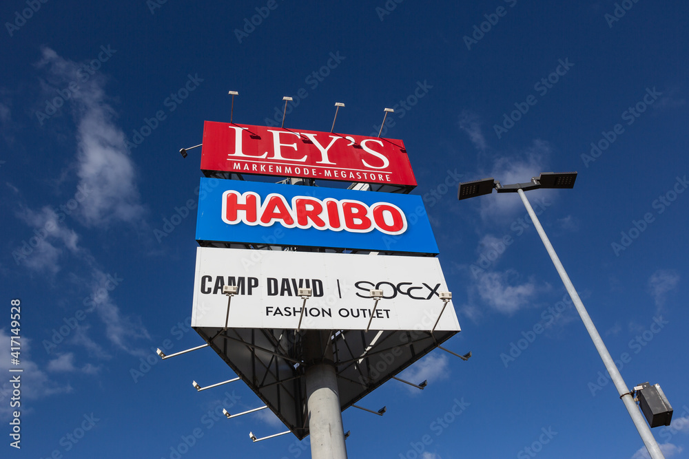 Mulheim-Karlich, Germany - February 27, 2021: bottom view at an  advertisement tower with ads for the labels Ley's, Haribo, Camp David and  Soccx Stock Photo | Adobe Stock