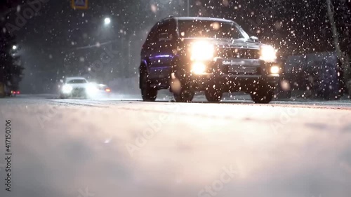 the car drives through a blizzard. car at night