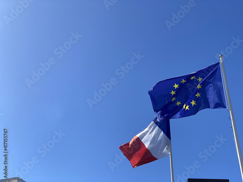 European and french flags on a very blue sky
