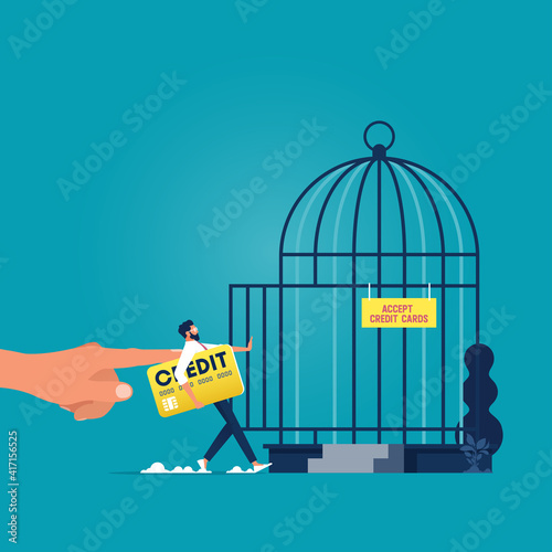 Debt trap-Forbidden or freedom of financial concept, Big hand push businessman with credit card in to birdcage metaphor of debt