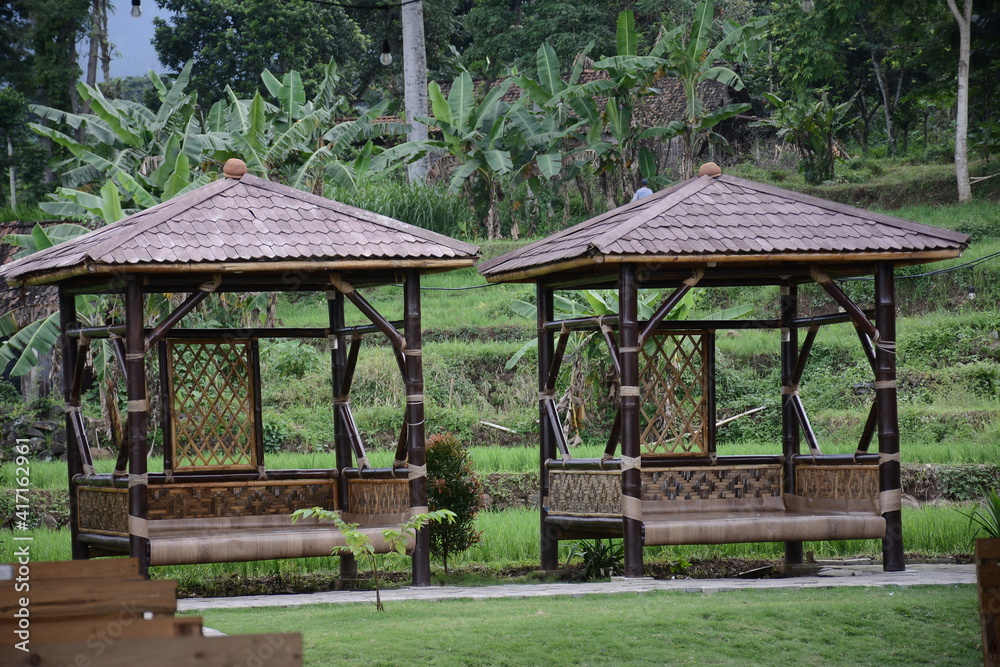 traditional design of gazebo made of wood in garden traditional design of gazebo made of wood in garden