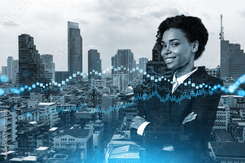 Successful smiling attractive black woman trader suggesting a new strategy of investment in stocks to grow client income. Woman in business concept. Forex chart. Bangkok. Double exposure.