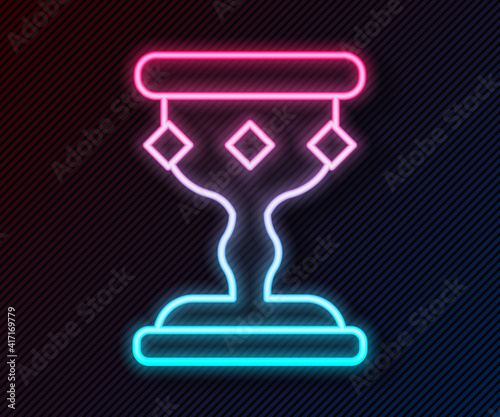 Glowing neon line Medieval goblet icon isolated on black background. Vector.