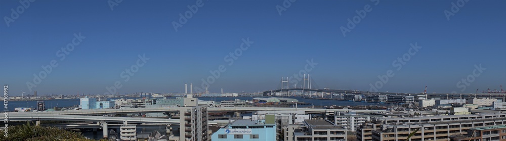 Yokohama City landscape from Observatory of Harbor Viewing Park in Yokohama, Japan. Bay bridge and Yamashita Pier, Panoramic shot - 港の見える丘公園からの眺望 ベイブリッジ 山下ふ頭 横浜 日本 パノラマ
