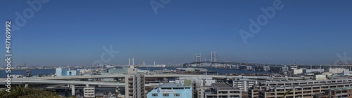 Yokohama City landscape from Observatory of Harbor Viewing Park in Yokohama, Japan. Bay bridge and Yamashita Pier, Panoramic shot - 港の見える丘公園からの眺望 ベイブリッジ 山下ふ頭 横浜 日本 パノラマ photo