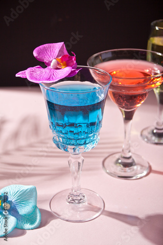 Summer tropical blue and blue cocktail decorated purple and blue orchid flower