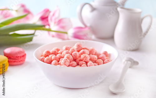 bowl with strawberry sweet corn balls. Delicious and healthy breakfast cereal.