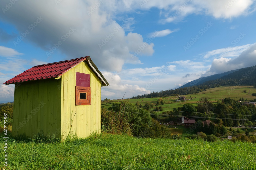 Little green house in mountains