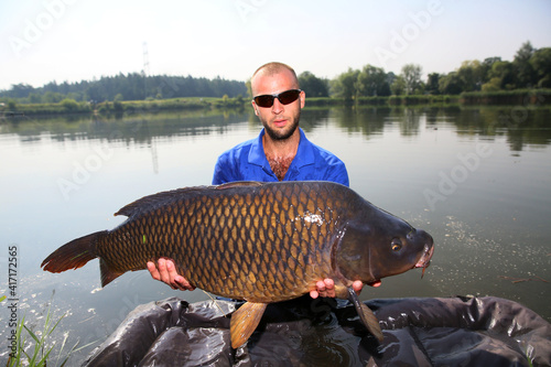 The angler caught a very large carp 
