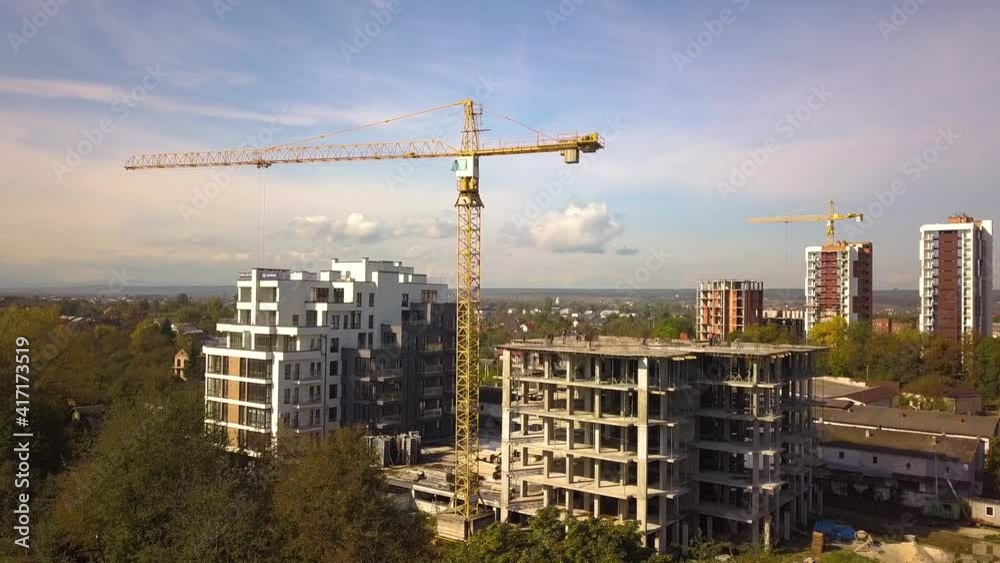 Aerial view of high residential apartment buildings under construction. Real estate development. Aerial view of high residential apartment buildings under construction. Real estate development.