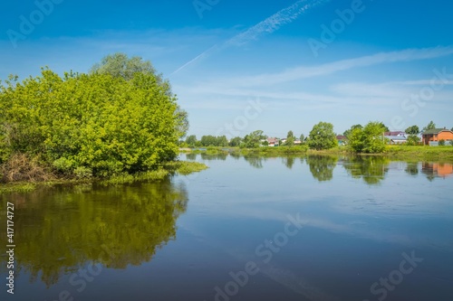 Fototapeta Naklejka Na Ścianę i Meble -  Rural river and blue sky