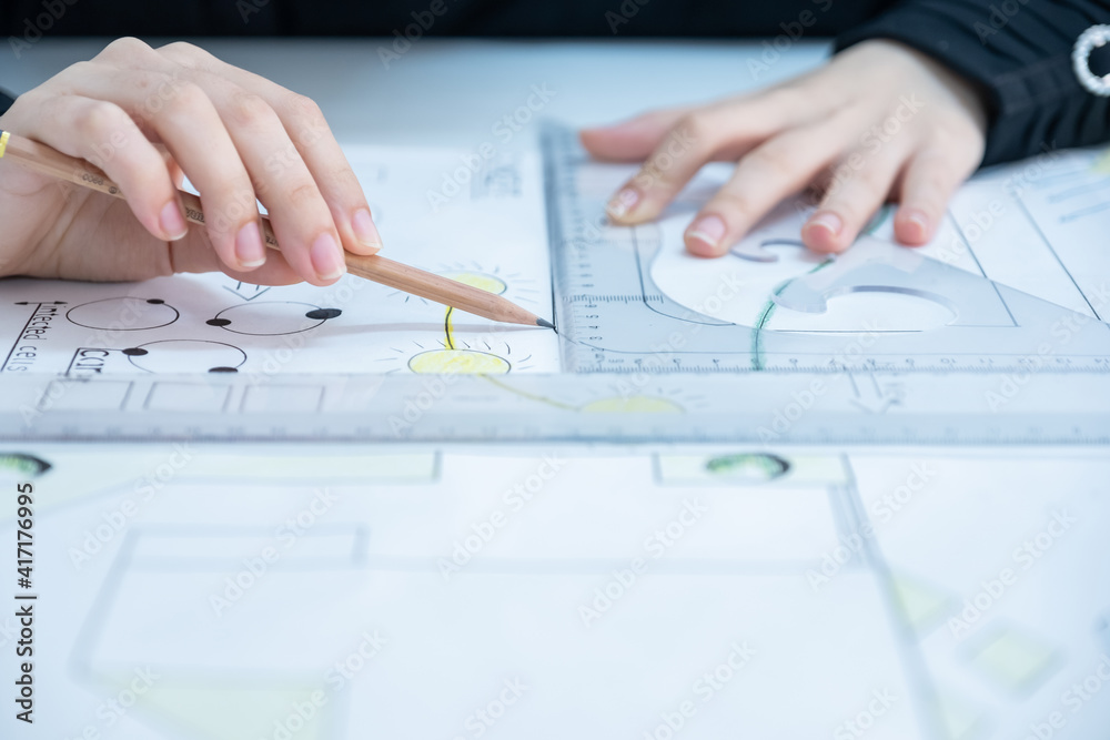 Architect hands with pen and ruler