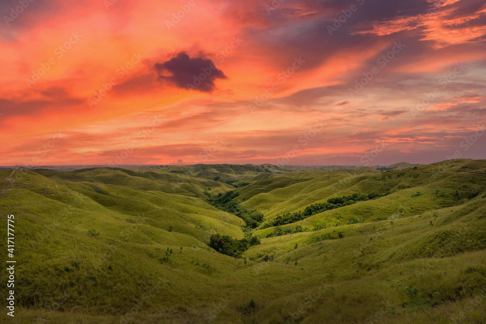 Vibrant sunset at Wairinding Hill in Sumba Island, East Java of  Indonesia