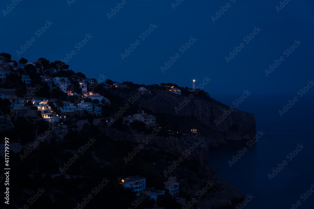 Residential area on top of a cliff on the coast of Cabo Nao in Javea at night, Javea, Alicante, Spain