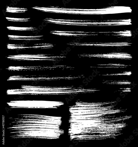 vector whitt brush splatters on black background