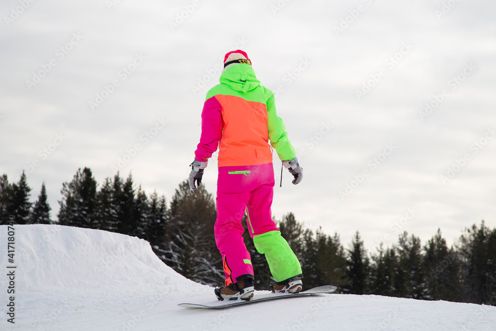 A snowboarder on a snowboard. Extreme winter sports.Rest in winter.