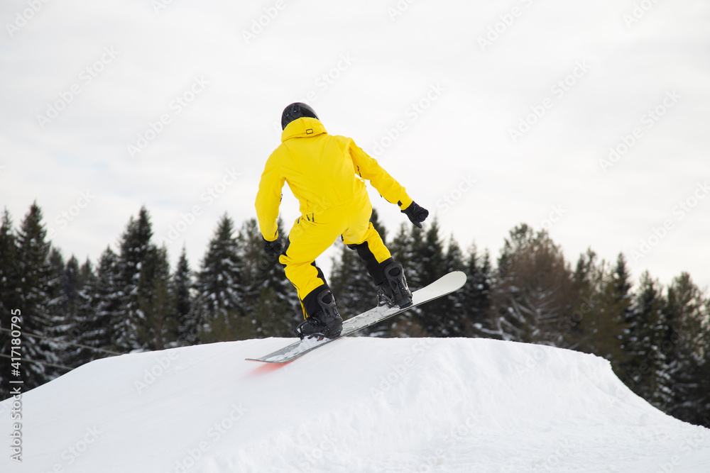 A snowboarder on a snowboard. Extreme winter sports.Rest in winter.