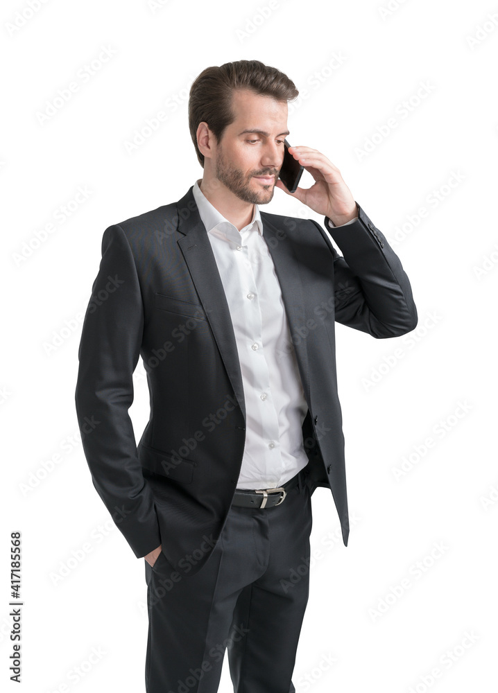 Half length portrait of businessman in formal suit talking on mobile phone holding his hand in pocket. Isolated on white background. Half length portrait of businessman in formal suit talking on mobile phone holding his hand in pocket. Isolated on white background.