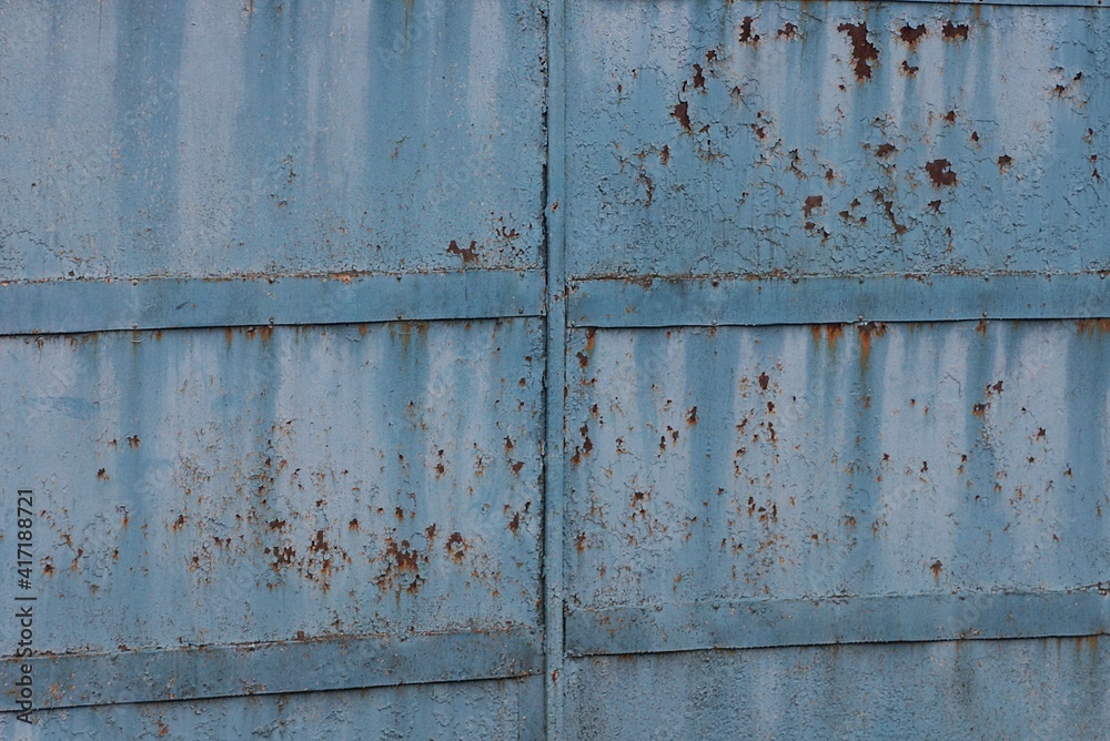 blue gray metal texture from old rusty wall with shabby paint and seams