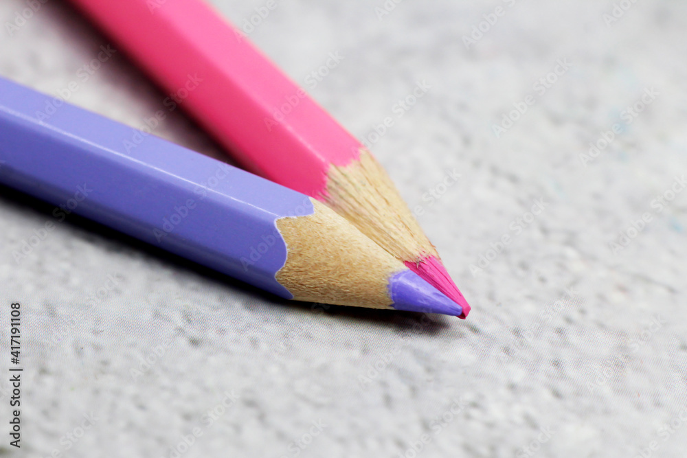 close up of color pencils, purple and pink color close up of color pencils, purple and pink color