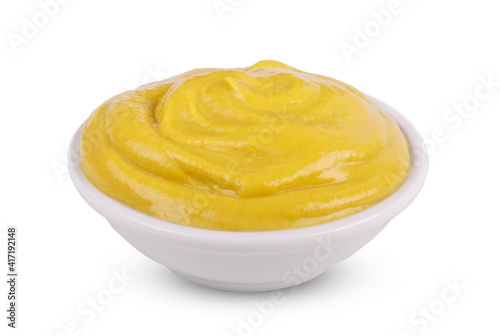 Mustard tasty sauce in bowl isolated on white background.